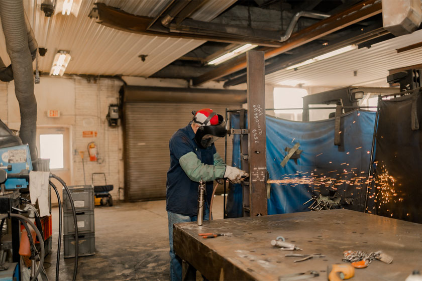 Man Cutting Beam